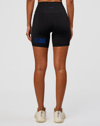Woman wearing Fusion Hype Graphic Ultra High-Rise 6" Short Pockets - Black-Electric Indigo | Model:Charli | Size:XS | Thumbnail Index: 6