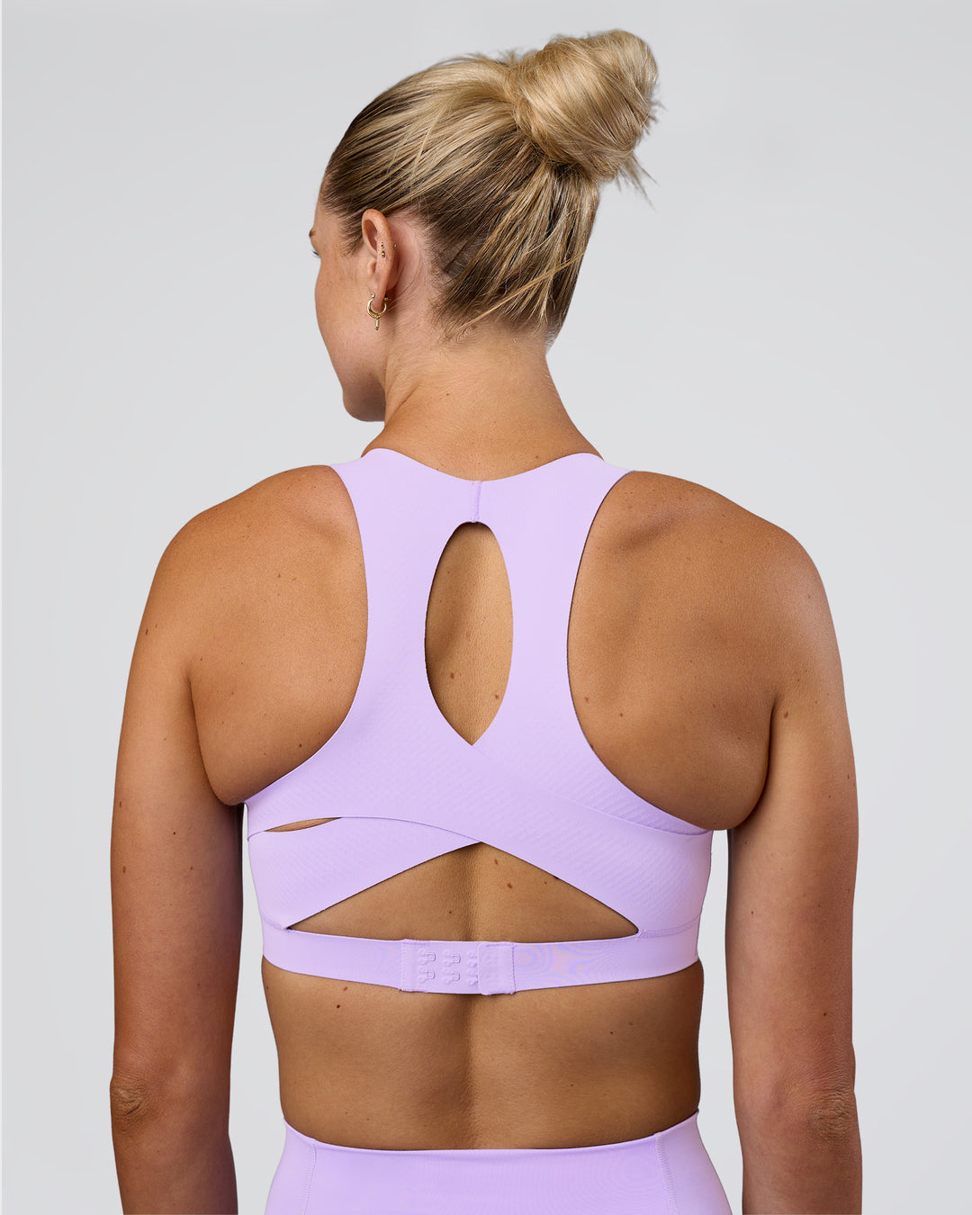 Woman wearing Fusion Sports Bra 2.0 - Pale Lilac | Model:Emelia | Size:XS - view 2