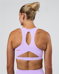 Woman wearing Fusion Sports Bra 2.0 - Pale Lilac | Model:Emelia | Size:XS | Thumbnail Index: 1