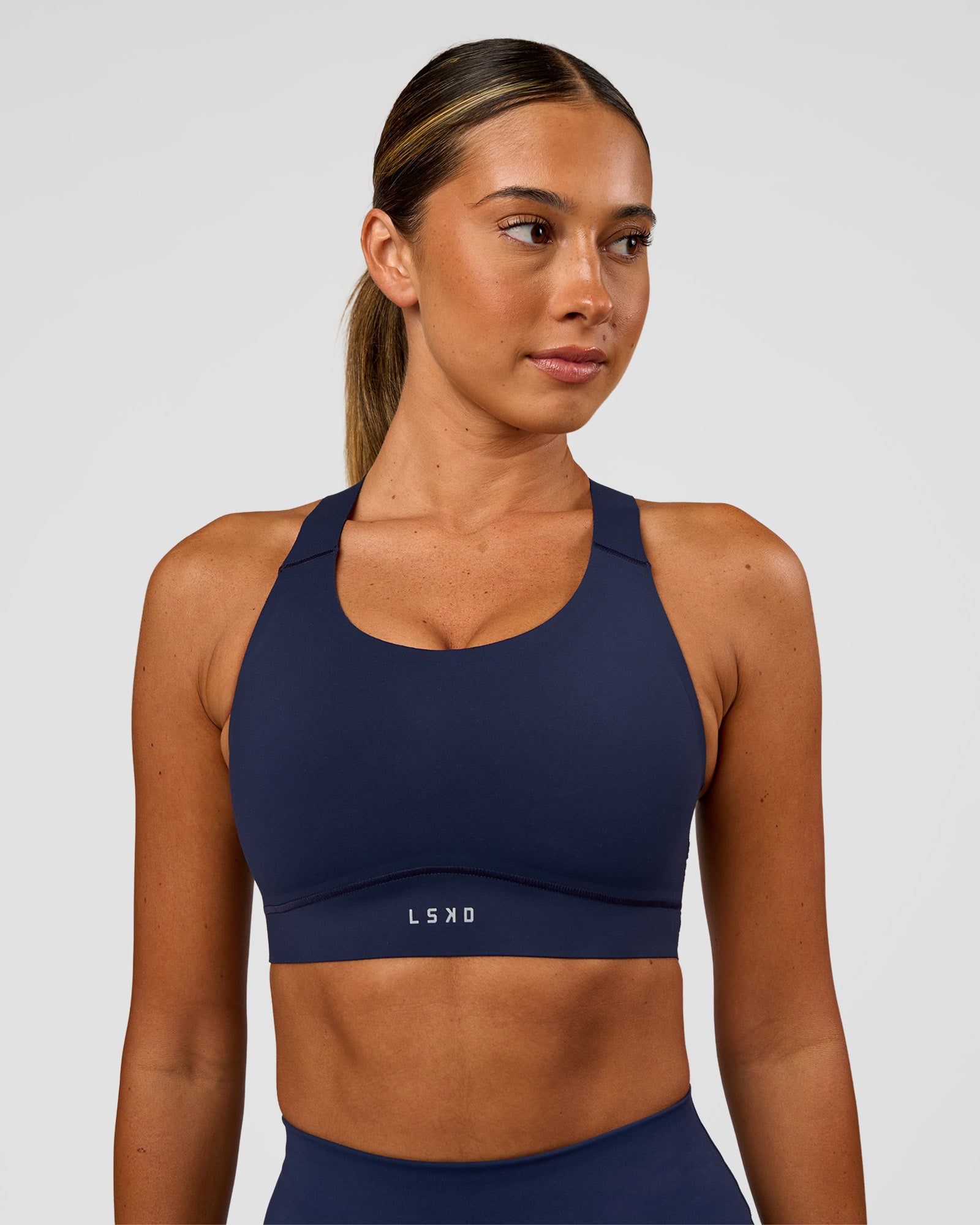 Woman wearing Fusion Sports Bra 2.0 - Future Navy | Model:Charlie | Size:S