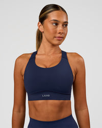 Woman wearing Fusion Sports Bra 2.0 - Future Navy | Model:Charlie | Size:S | Thumbnail Index: 0
