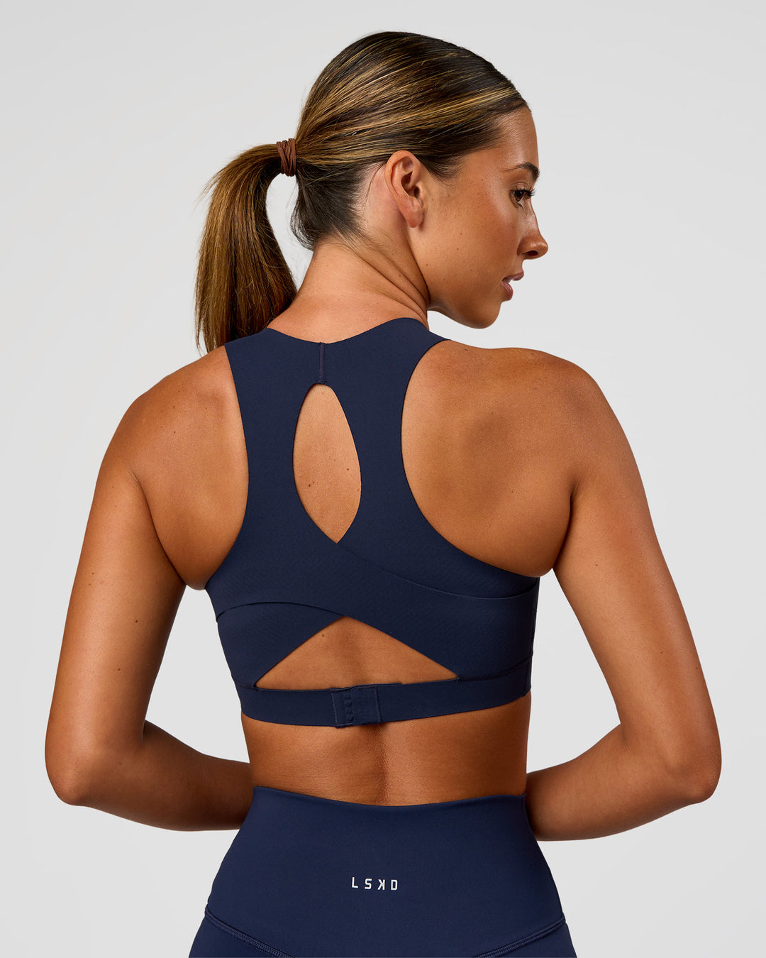 Woman wearing Fusion Sports Bra 2.0 - Future Navy | Model:Charlie | Size:S - view 2