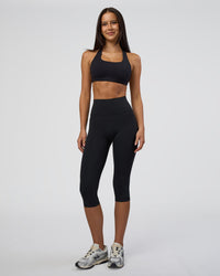 Woman wearing Fusion Ultra High-Rise 3/4 Legging Pockets - Black | Model:Eliza | Size:XS | Thumbnail Index: 5