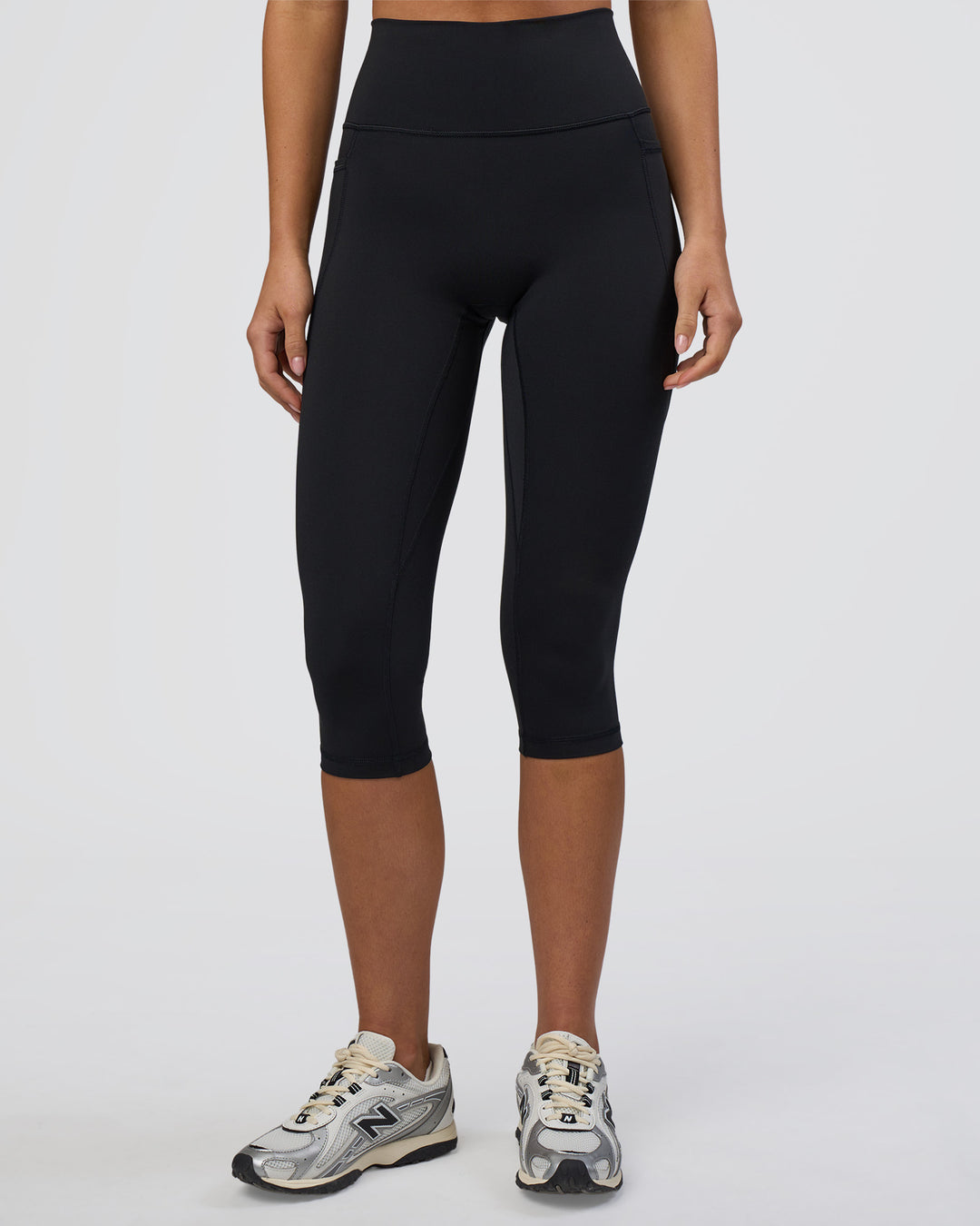 Woman wearing Fusion Ultra High-Rise 3/4 Legging Pockets - Black | Model:Eliza | Size:XS - view 7