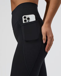 Woman wearing Fusion Ultra High-Rise 3/4 Legging Pockets - Black | Model:Eliza | Size:XS | Thumbnail Index: 4