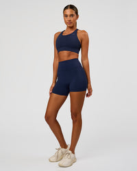Woman wearing Fusion Ultra High-Rise 4" Short - Future Navy | Model:Charli | Size:XS | Thumbnail Index: 5