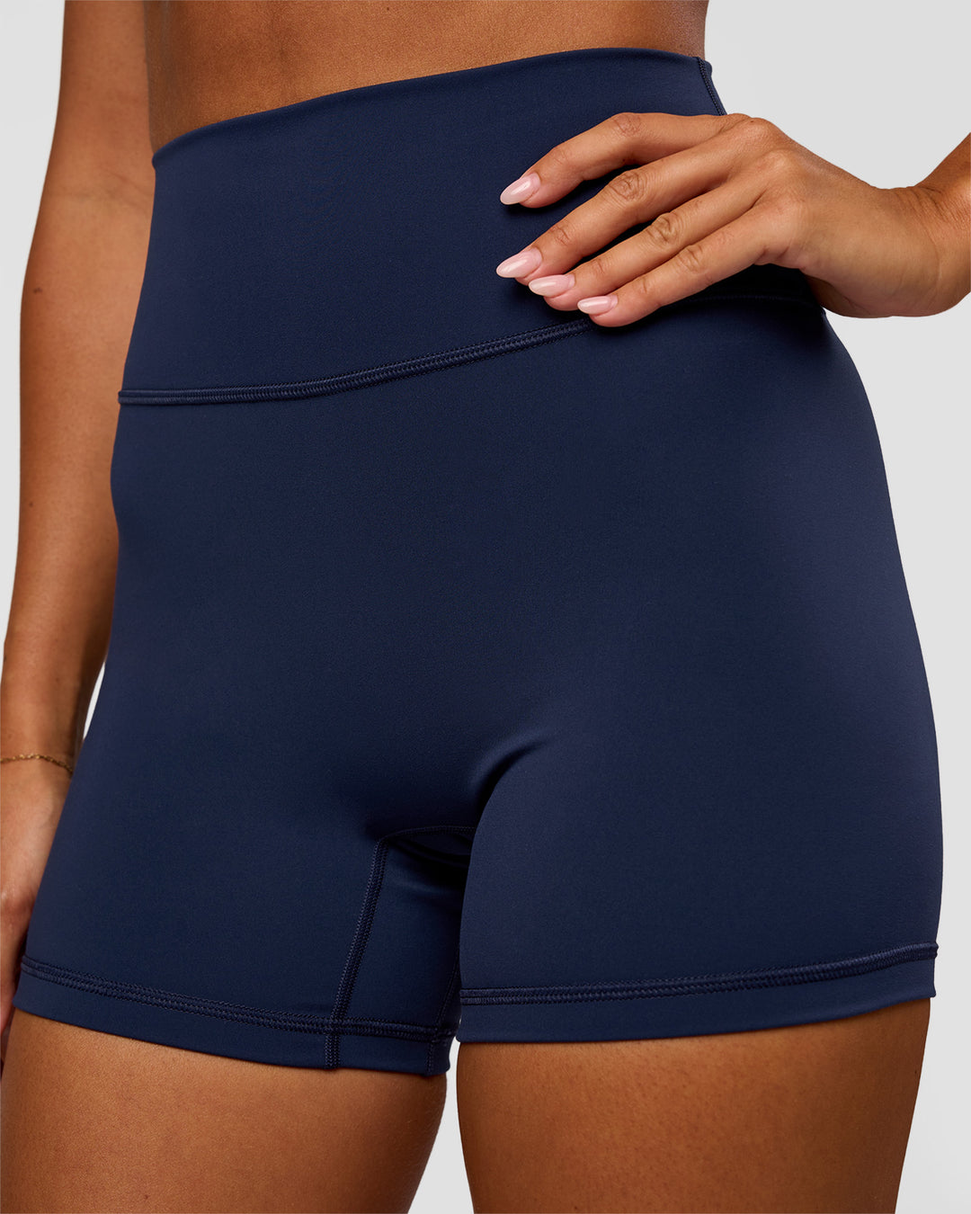 Woman wearing Fusion Ultra High-Rise 4" Short - Future Navy | Set:true | Angle:closeup | Model:Charli | Size:XS - view 3