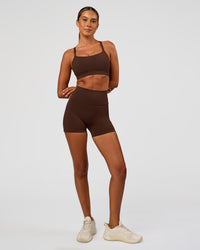 Woman wearing Fusion Ultra High-Rise 4" Short Pockets - Hot Chocolate | Model:Charli | Size:XS | Thumbnail Index: 6