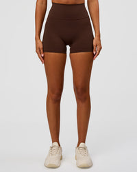 Woman wearing Fusion Ultra High-Rise 4" Short Pockets - Hot Chocolate | Set:true | Angle:front | Model:Charli | Size:XS | Thumbnail Index: 7