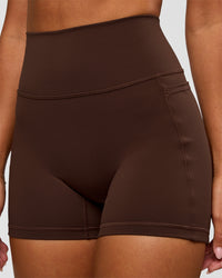 Woman wearing Fusion Ultra High-Rise 4" Short Pockets - Hot Chocolate | Model:Charli | Size:XS | Thumbnail Index: 10