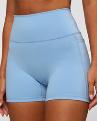 Woman wearing Fusion Ultra High-Rise 4" Short Pockets - Open Air | Model:Charli | Size:XS | Thumbnail Index: 9