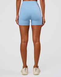 Woman wearing Fusion Ultra High-Rise 4" Short Pockets - Open Air | Set:true | Angle:back | Model:Charli | Size:XS | Thumbnail Index: 2
