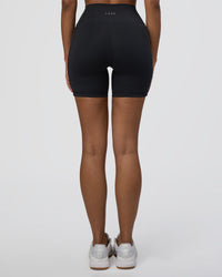 Woman wearing Fusion Ultra High-Rise 6" Short Pockets - Black | Set:true | Angle:back | Model:Jordan | Size:S | Thumbnail Index: 3