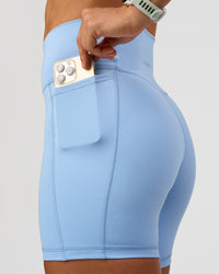 Woman wearing Fusion Ultra High-Rise 6" Short Pockets - Open Air | Set:true | Angle:closeup | Model:Maja | Size:XS | Thumbnail Index: 0