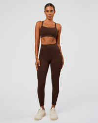 Woman wearing Fusion Ultra High-Rise 7/8 Legging Pockets - Hot Chocolate | Model:Charli | Size:XS | Thumbnail Index: 1