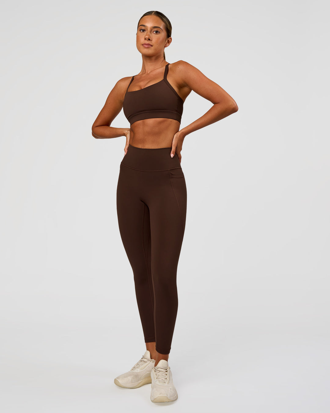 Woman wearing Fusion Ultra High-Rise 7/8 Legging Pockets - Hot Chocolate | Model:Charli | Size:XS - view 8