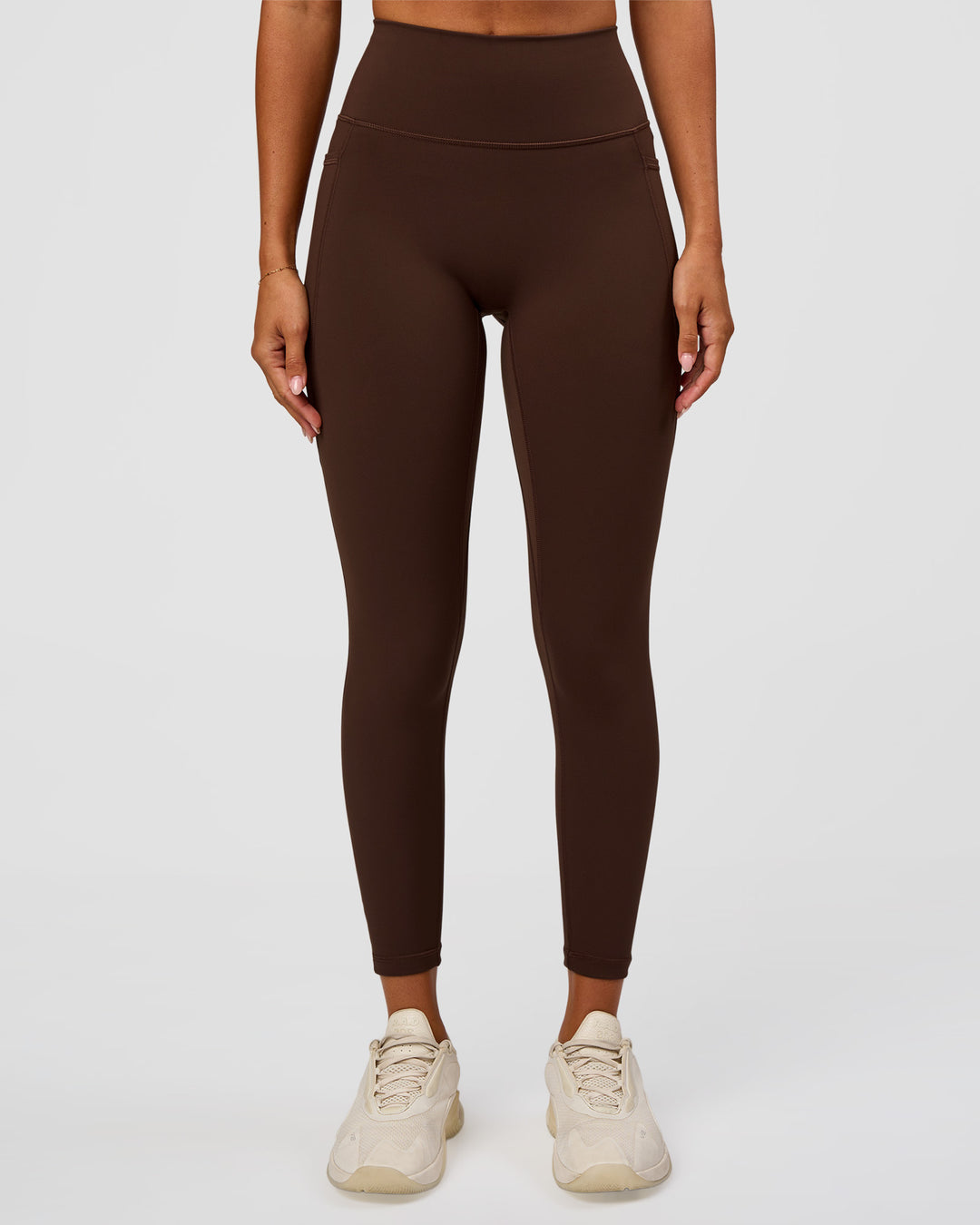 Woman wearing Fusion Ultra High-Rise 7/8 Legging Pockets - Hot Chocolate | Model:Charli | Size:XS - view 5