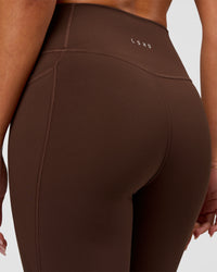 Woman wearing Fusion Ultra High-Rise 7/8 Legging Pockets - Hot Chocolate | Model:Charli | Size:XS | Thumbnail Index: 9