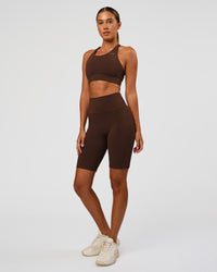 Woman wearing Fusion Ultra High-Rise 9" Short Pockets - Hot Chocolate | Model:Charli | Size:XS | Thumbnail Index: 4