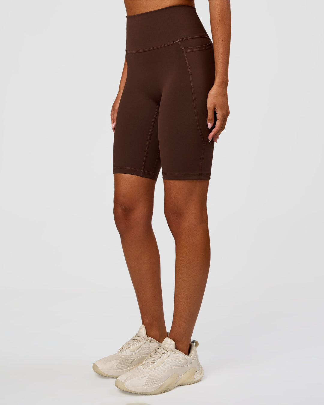 Woman wearing Fusion Ultra High-Rise 9" Short Pockets - Hot Chocolate | Model:Charli | Size:XS - view 7