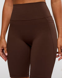Woman wearing Fusion Ultra High-Rise 9" Short Pockets - Hot Chocolate | Model:Charli | Size:XS | Thumbnail Index: 5