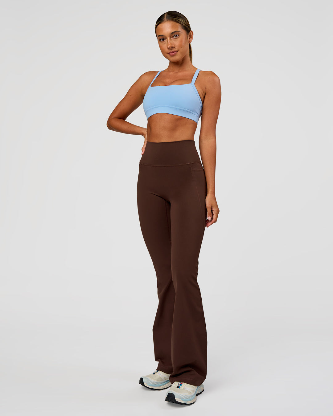 Woman wearing Fusion Ultra High-Rise Flared Legging Pockets - Hot Chocolate | Model:Charli | Size:XS - view 5