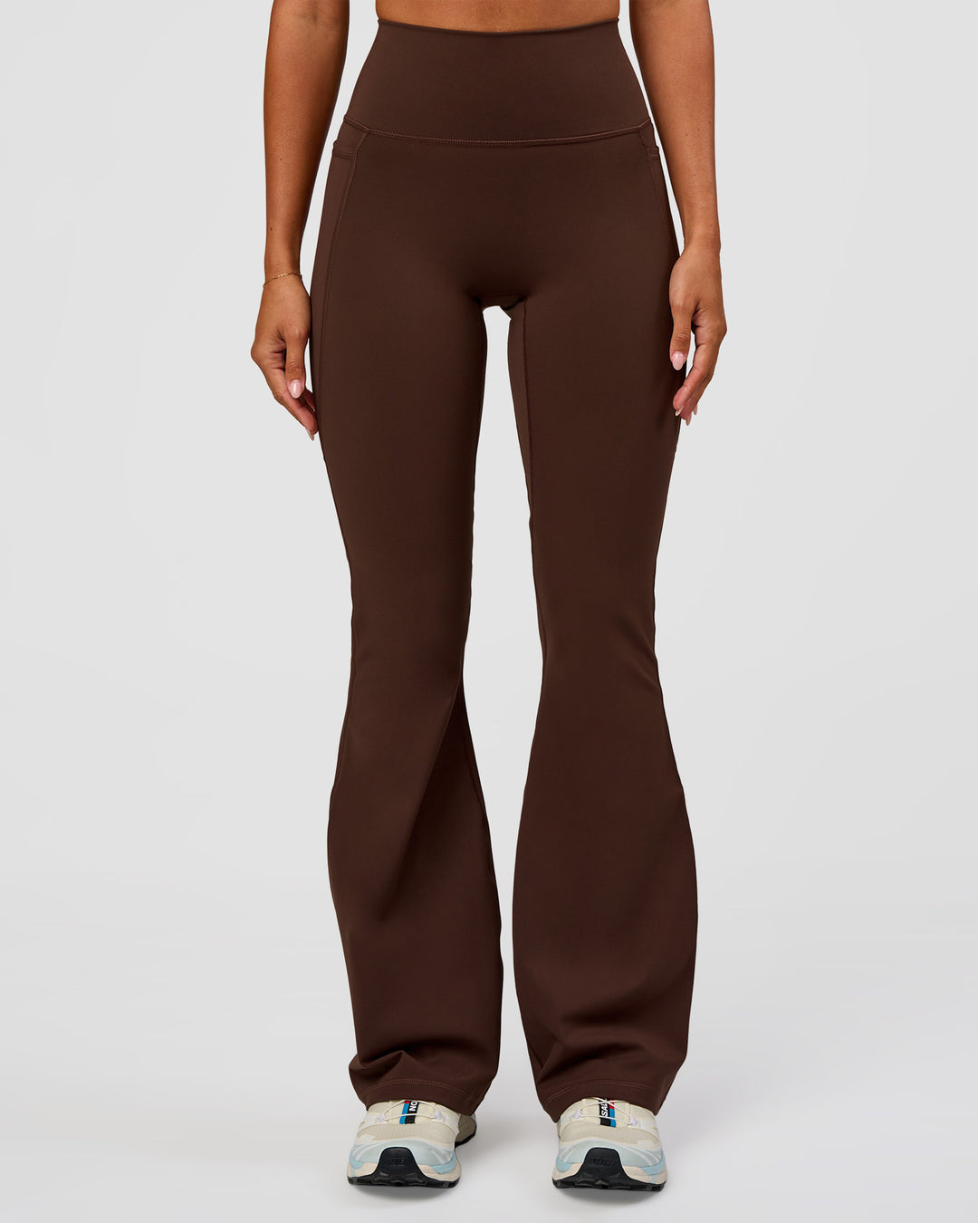 Woman wearing Fusion Ultra High-Rise Flared Legging Pockets - Hot Chocolate | Model:Charli | Size:XS - view 6