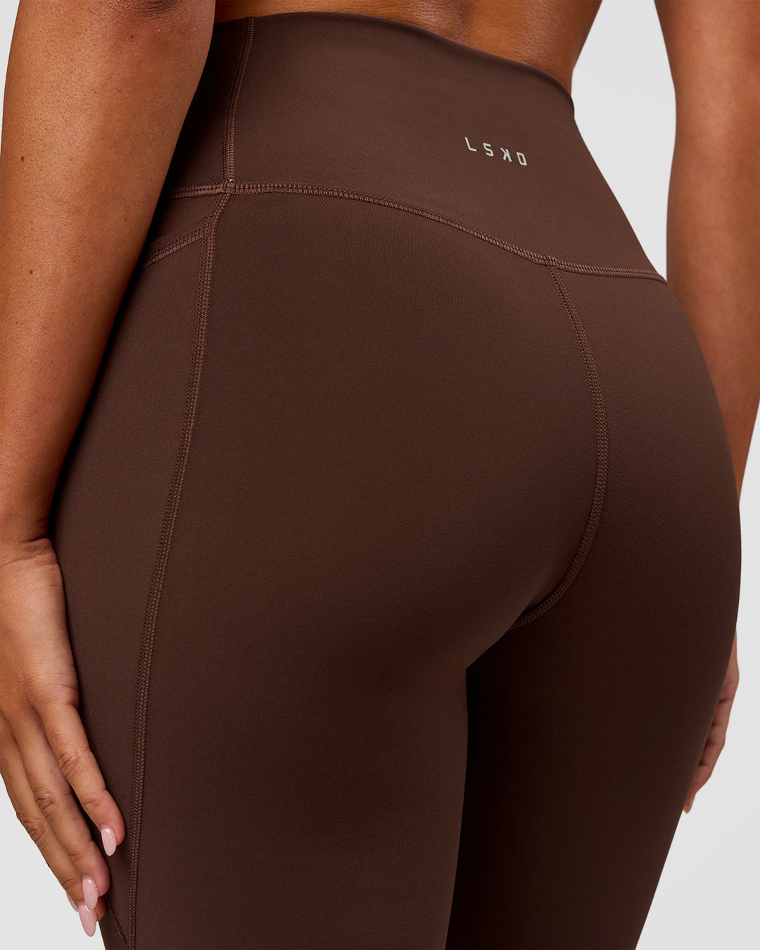 Woman wearing Fusion Ultra High-Rise Flared Legging Pockets - Hot Chocolate | Model:Charli | Size:XS - view 8