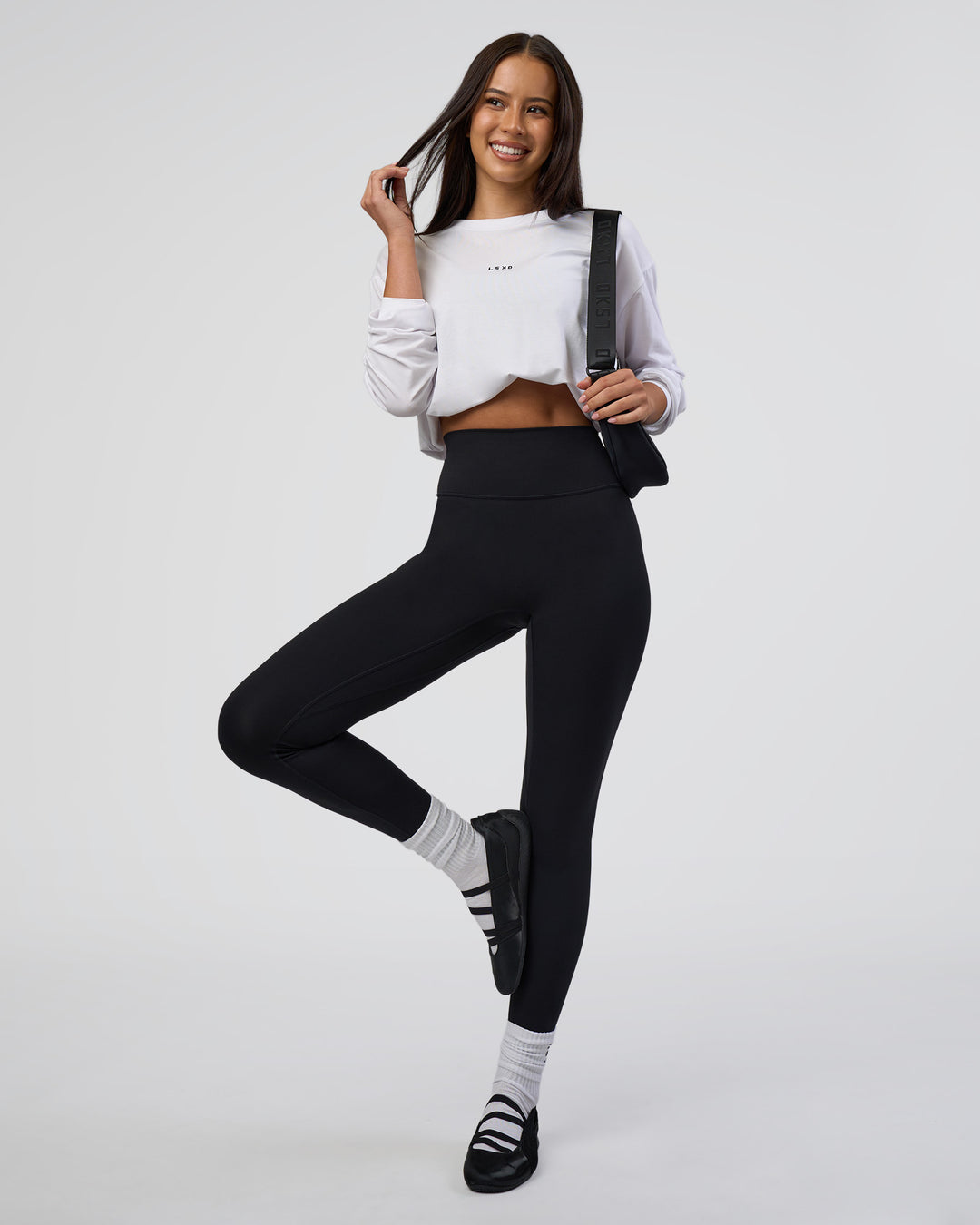 Woman wearing Fusion Ultra High-Rise Full Length Legging - Black | Model:Eliza | Size:XS - view 2
