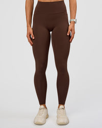 Woman wearing Fusion Ultra High-Rise Full Length Legging Pockets - Hot Chocolate | Model:Maja | Size:XS | Thumbnail Index: 0