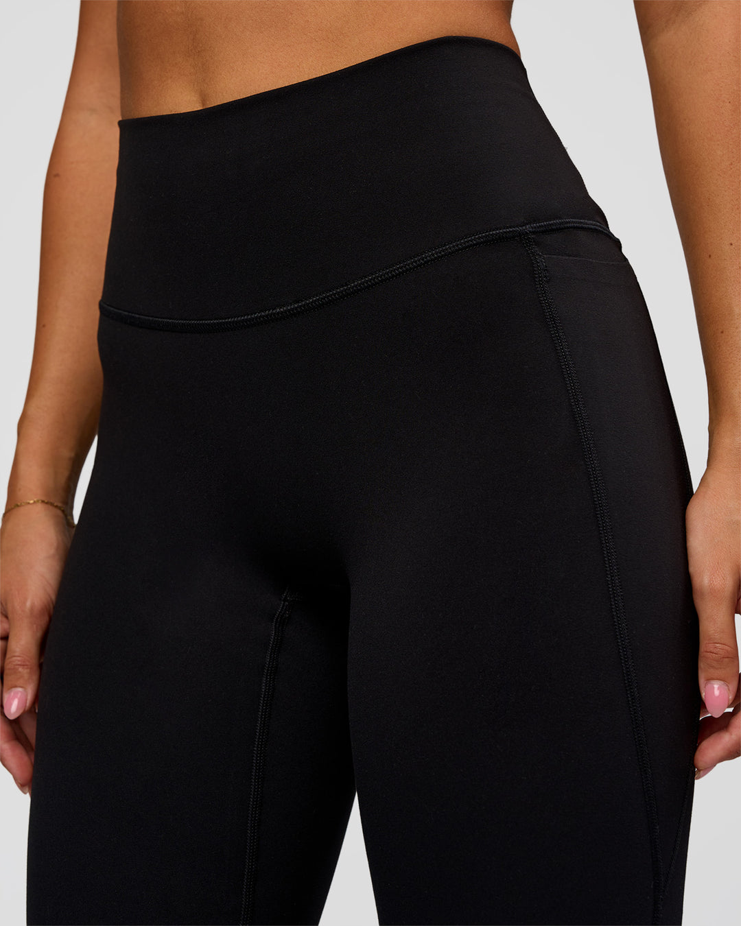 Woman wearing Fusion V-Contour High-Rise Flared Legging Pockets - Black | Model:Charli | Size:XS - view 7