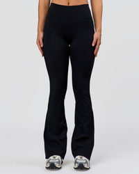 Woman wearing Fusion V-Contour High-Rise Flared Petite Legging Pockets - Black | Model:Issy | Size:XS | Thumbnail Index: 3