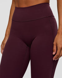 Woman wearing Fusion V-Contour High-Rise Flared Petite Legging Pockets - Cherry Lacquer | Model:Brylee | Size:XS | Thumbnail Index: 8