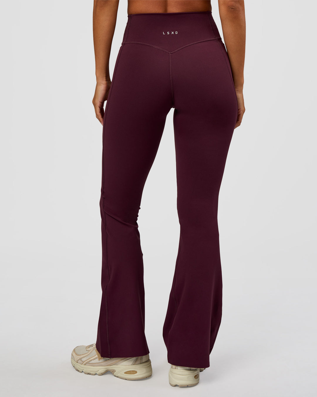 Woman wearing Fusion V-Contour High-Rise Flared Petite Legging Pockets - Cherry Lacquer | Model:Brylee | Size:XS - view 6