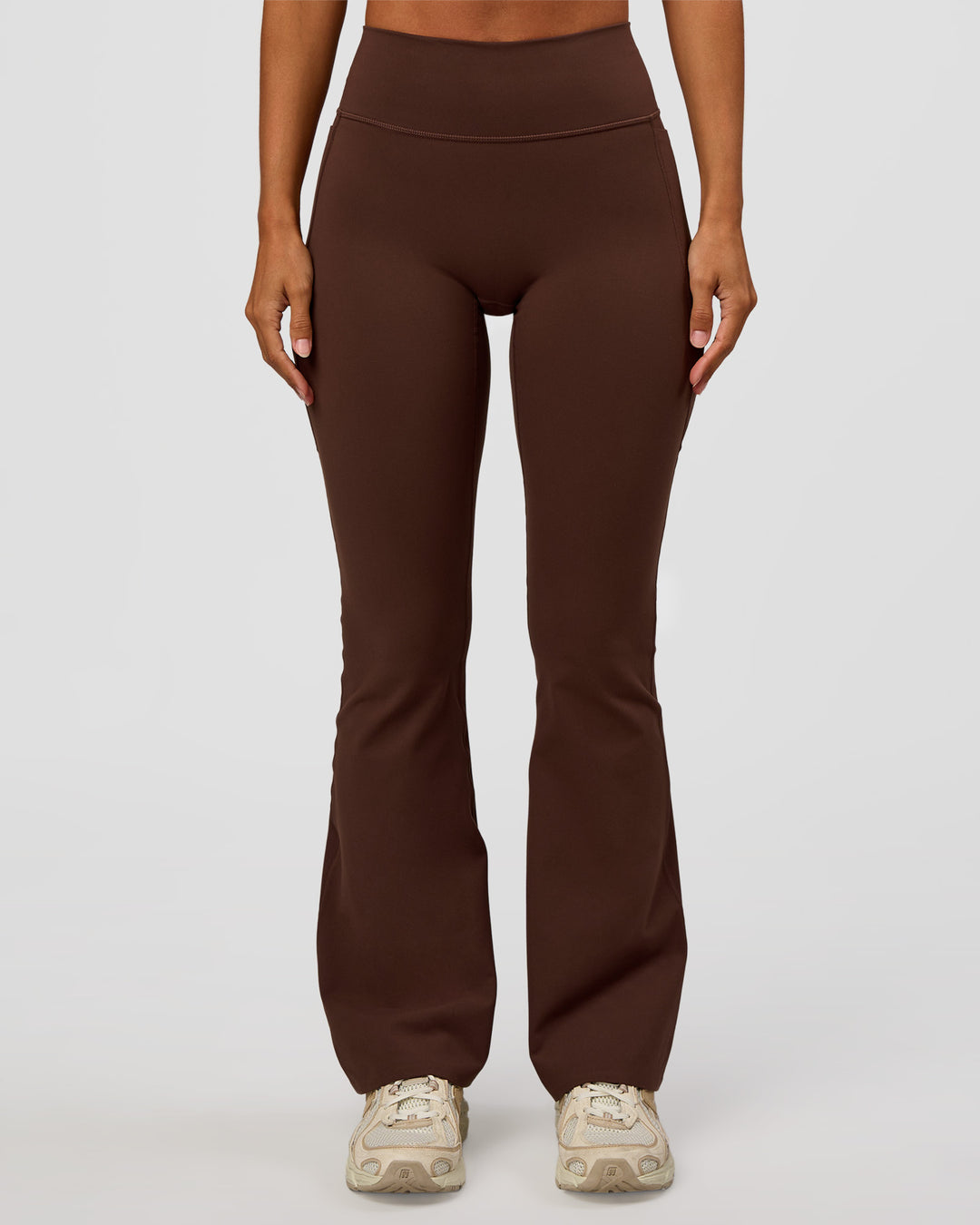 Woman wearing Fusion V-Contour High-Rise Flared Petite Legging Pockets - Hot Chocolate | Model:Brylee | Size:XS - view 9