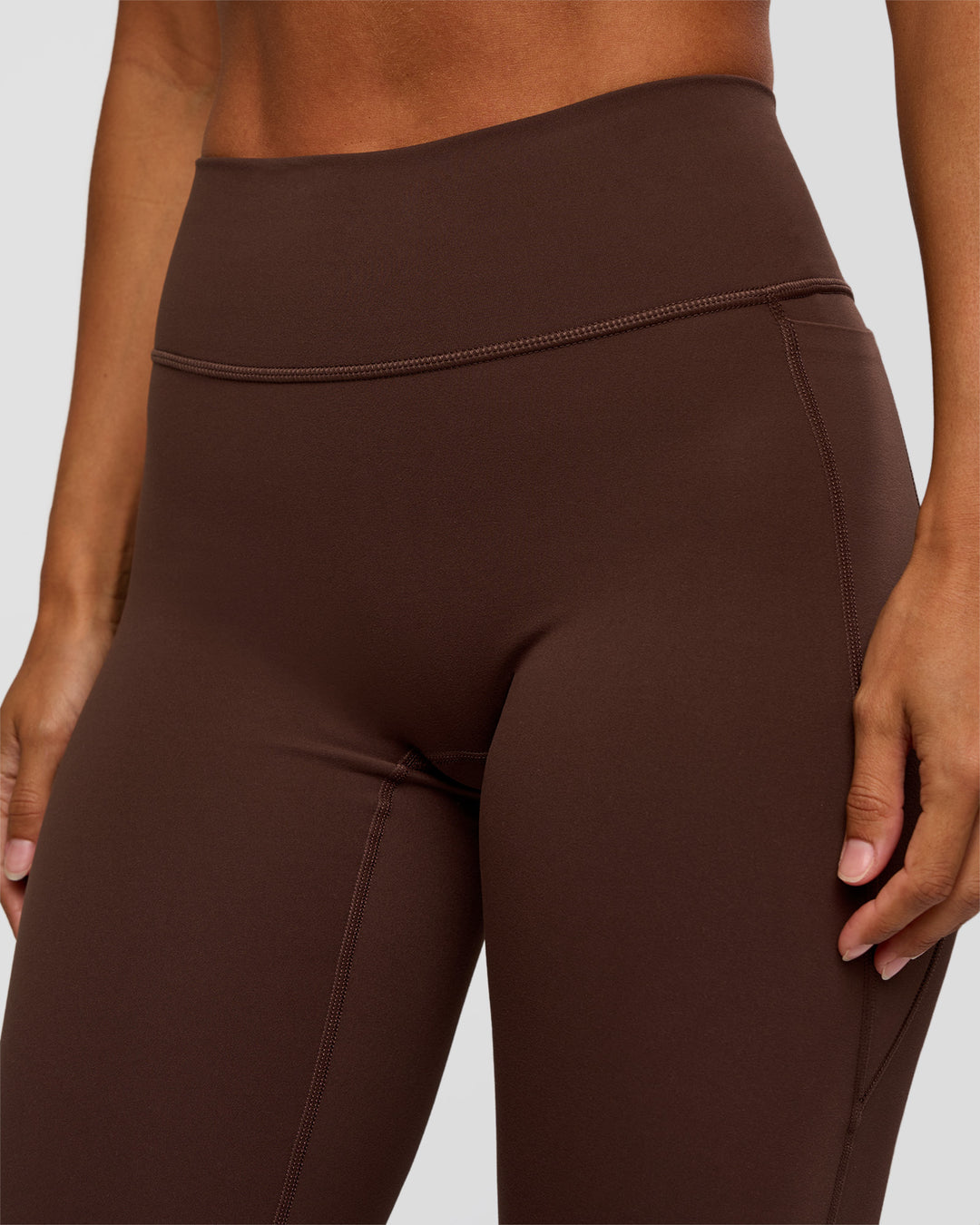 Woman wearing Fusion V-Contour High-Rise Flared Petite Legging Pockets - Hot Chocolate | Model:Brylee | Size:XS - view 8