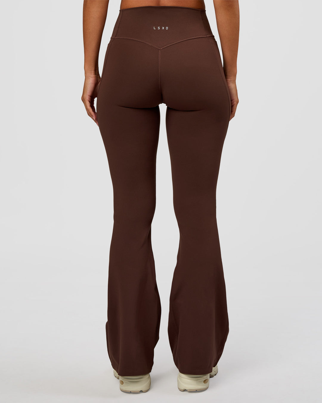 Woman wearing Fusion V-Contour High-Rise Flared Petite Legging Pockets - Hot Chocolate | Model:Brylee | Size:XS - view 7