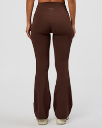 Woman wearing Fusion V-Contour High-Rise Flared Petite Legging Pockets - Hot Chocolate | Model:Brylee | Size:XS | Thumbnail Index: 6