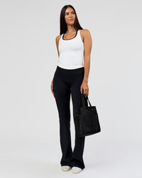 Woman wearing Fusion V-Contour High-Rise Flared Tall Legging Pockets - Black | Model:Rhiley | Size:S | Thumbnail Index: 3