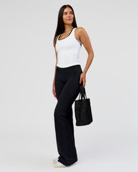 Woman wearing Fusion V-Contour High-Rise Flared Tall Legging Pockets - Black | Model:Rhiley | Size:S | Thumbnail Index: 9