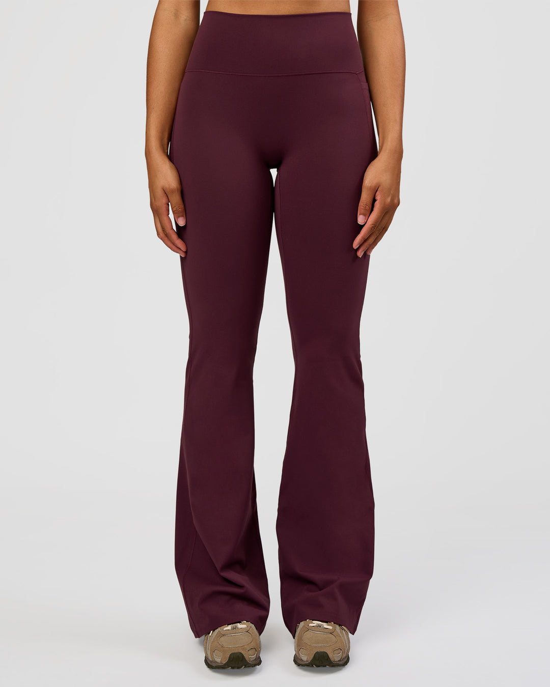 Woman wearing Fusion V-Contour High-Rise Flared Tall Legging Pockets - Cherry Lacquer | Model:Rosie | Size:S - view 1