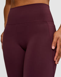 Woman wearing Fusion V-Contour High-Rise Flared Tall Legging Pockets - Cherry Lacquer | Model:Rosie | Size:S | Thumbnail Index: 2