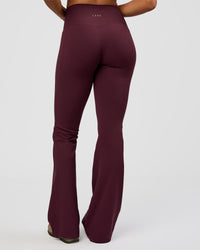 Woman wearing Fusion V-Contour High-Rise Flared Tall Legging Pockets - Cherry Lacquer | Model:Rosie | Size:S | Thumbnail Index: 4