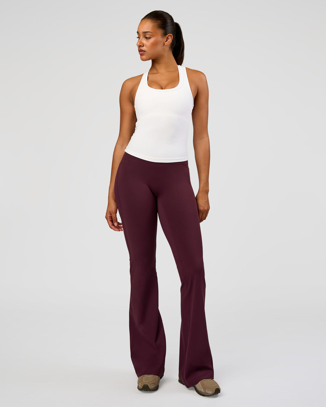 Woman wearing Fusion V-Contour High-Rise Flared Tall Legging Pockets - Cherry Lacquer | Model:Rosie | Size:S - view 6