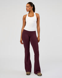 Woman wearing Fusion V-Contour High-Rise Flared Tall Legging Pockets - Cherry Lacquer | Model:Rosie | Size:S | Thumbnail Index: 5