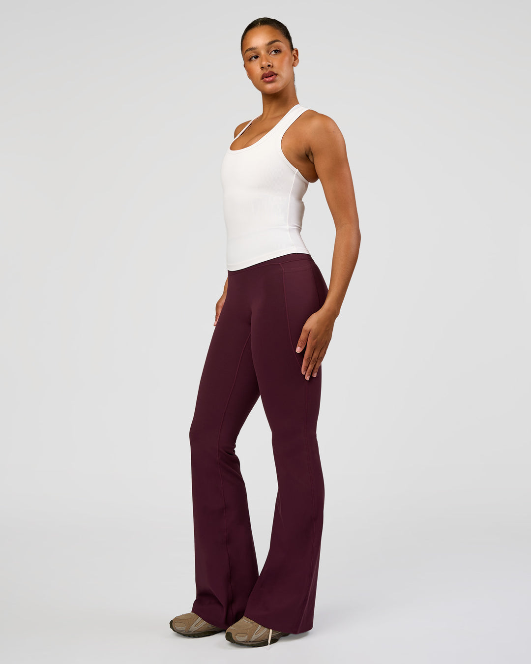 Woman wearing Fusion V-Contour High-Rise Flared Tall Legging Pockets - Cherry Lacquer | Model:Rosie | Size:S - view 7
