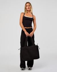 Woman wearing Fusion V-Contour High-Rise Petite Pant - Black | Model:Issy | Size:XS | Thumbnail Index: 9