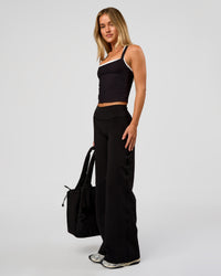 Woman wearing Fusion V-Contour High-Rise Petite Pant - Black | Model:Issy | Size:XS | Thumbnail Index: 10
