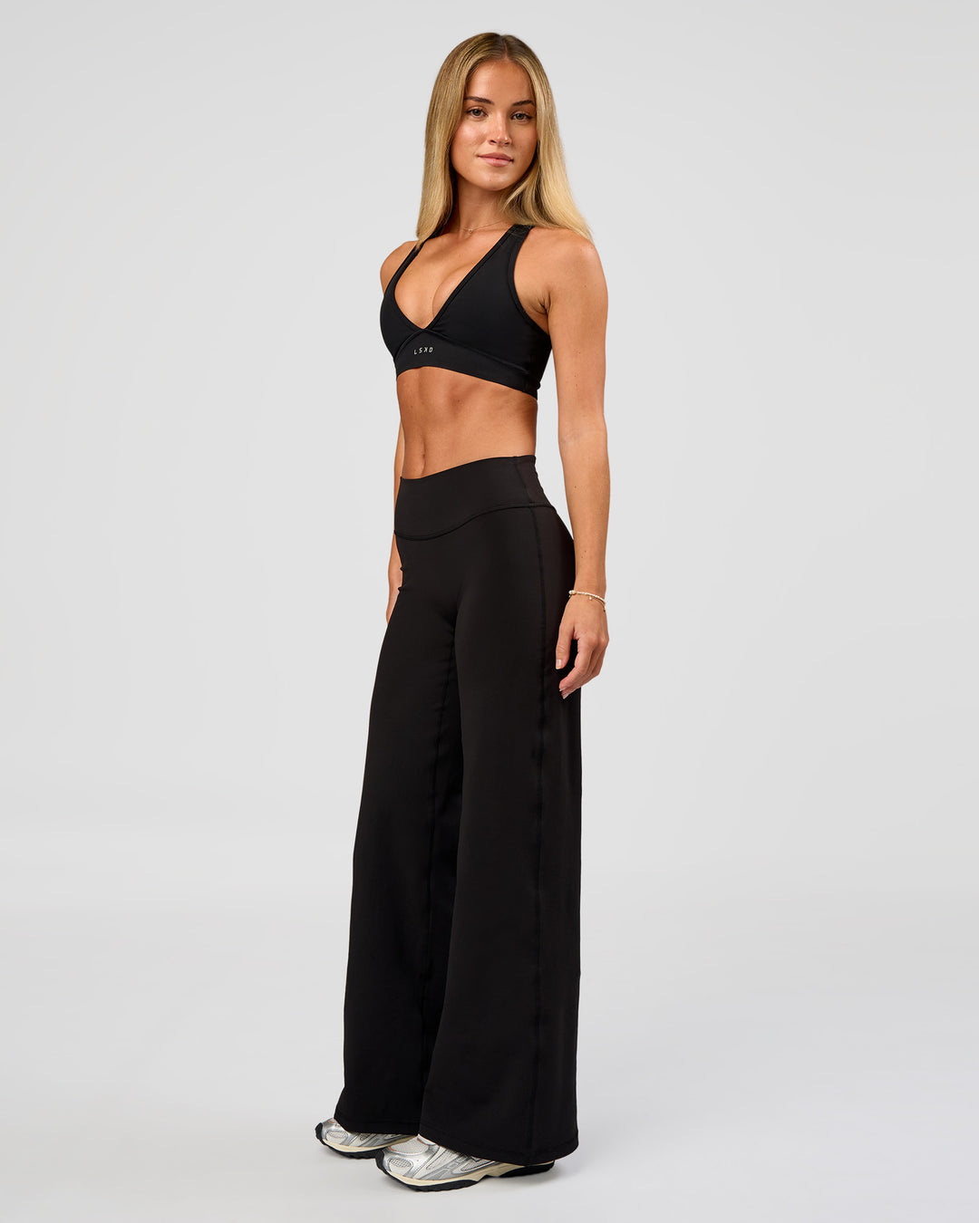 Woman wearing Fusion V-Contour High-Rise Petite Pant - Black | Model:Issy | Size:XS - view 5