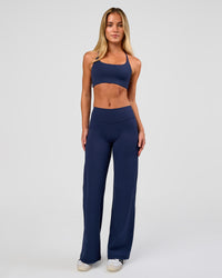 Model wearing Fusion V-Contour High-Rise Petite Pant - Future Navy | Model:Issy | Size:XS | Thumbnail Index: 2
